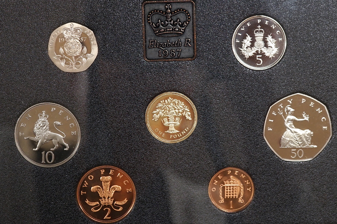 Assorted display sets of coins including two Canadian silver dollars